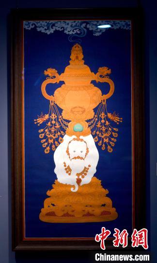 圖為5月16日，展覽中的新創(chuàng)唐卡作品《瑞象承香》?！±盍?攝